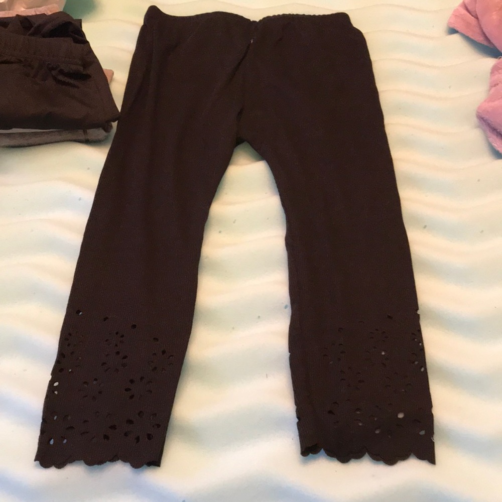 Black and grey capris, with flowers on leg